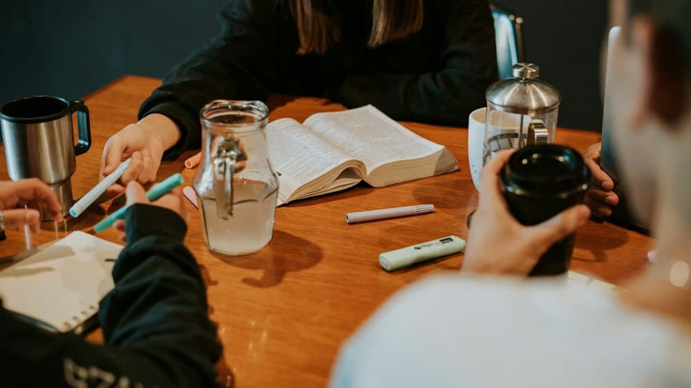 A small group studying the Bible